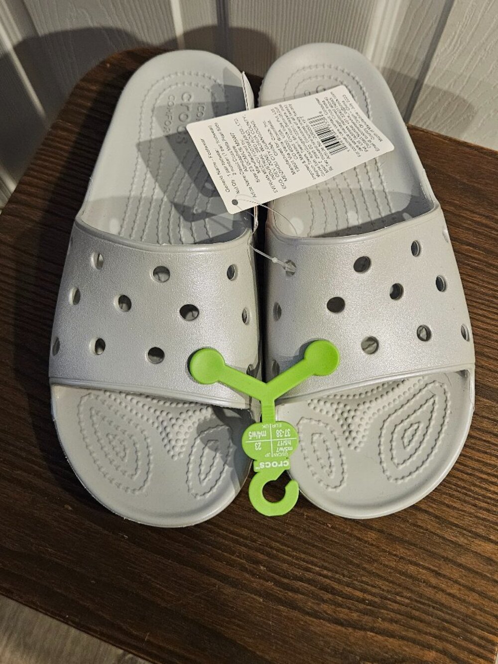 Crocs silver sandals. Women's size 7 men's size 5. New with tags